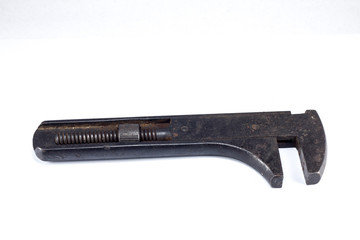 Sliding rusty wrench isolated on white background