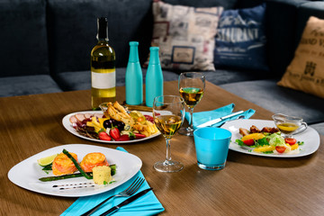 dinner and wine for a romantic evening in a restaurant, place for text, design layout