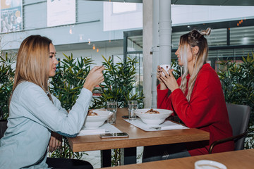 Female friends having lunch together