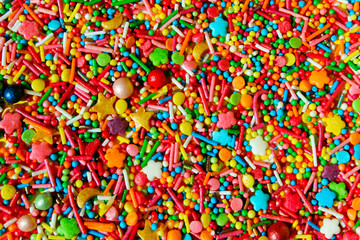 Fototapeta na wymiar Abstract Colorful Background. Colorful Candies Background With A Lot Of Copy Space For Text. Many Multicolored Candy Sweets. Closeup Of Multicolored Small Candies.