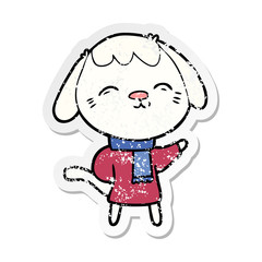 distressed sticker of a happy cartoon dog in winter clothes
