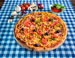 Ham and cheese pizza with peas sweetcorn and olives