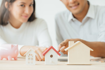 The best choice of house.House owner and architect discussing a choice.Couple dreaming of new home.