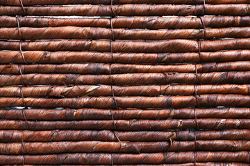 Close up on Side of Dark Woven Banana Leaf Basket