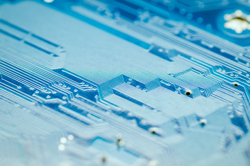 Lines of conductors on a blue printed circuit Board close-up