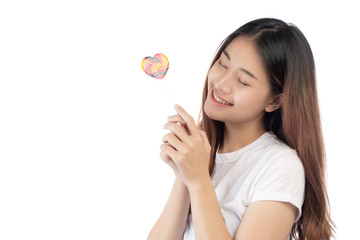 Beautiful woman with a happy smile holding a hand candy, isolated on white background.