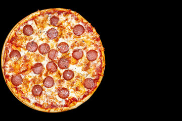 Fresh pizza with meat beaf chicken pork, tomatoes, vegetables, ushrooms on dark black background closeup