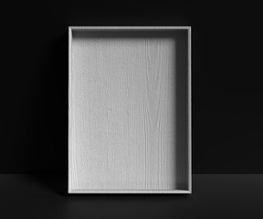 Grey empty wooden gift box on a dark background. Advertisement template. 3D rendering.