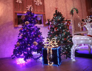 close up.large box with Christmas gifts near the Christmas tree