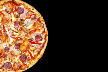Fresh pizza with meat beaf chicken pork, tomatoes, vegetables, ushrooms on dark black background closeup
