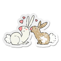 distressed sticker of a cartoon rabbits in love