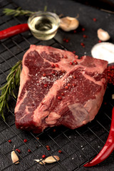 raw steak Porterhouse pepper rosemary garlic