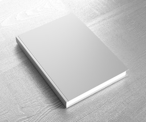 Gray hardcover book template on a wooden table. 3D rendering.