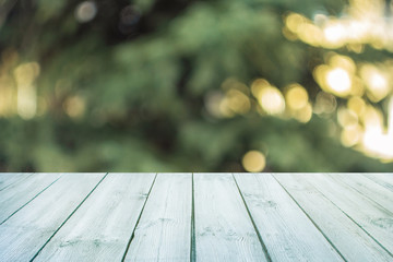 Empty blue wooden table with blurred city park on background. concept party, products, spring background