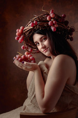 Beautiful girl with grapes.