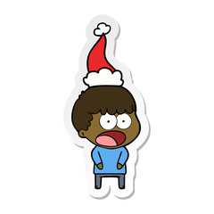 sticker cartoon of a shocked man wearing santa hat