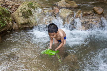 Children play happily in the stream.