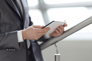 Close-up Of Businessman Looking At Digital Tablet