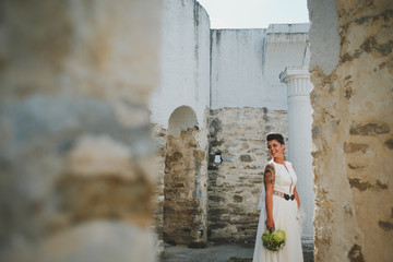 woman in front of old house