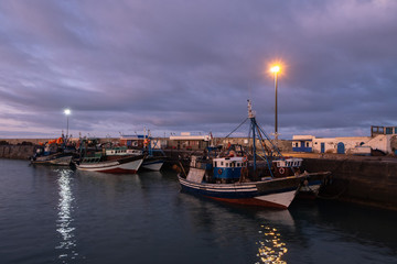 Fototapeta na wymiar Fishing port of Essaouira at the sunset time, Morocco