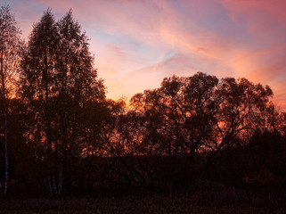 colorful sunset in the countryside in autumn