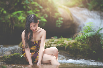 Fototapeta premium Happy bathing women at the natural waterfall.
