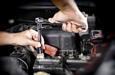 car engine repair hands