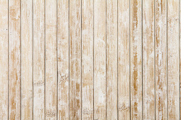 Obraz premium Light wooden background composed of vertical wooden planks ruined by time