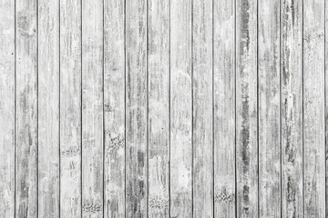Light wooden background composed of vertical wooden planks ruined by time