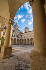 Fototapeta premium LECCE, Puglia ,Italy - Inside courtyard of university of Salento - UniSalento (Universita del Salento) and view to cupola of the church chiesa Maria ss.del Carmine. Apulia region