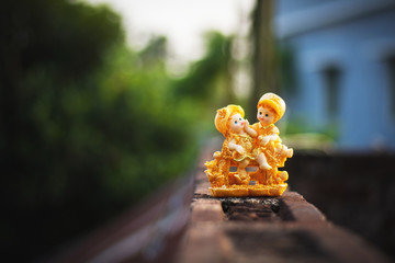 a picture of intimacy of a couple showpiece laid on the roof surface