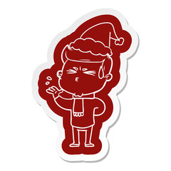cartoon  sticker of a man sweating wearing santa hat