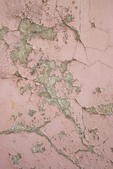 peeling paint on exterior wall grunge background