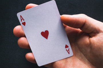 holding an ace card close up