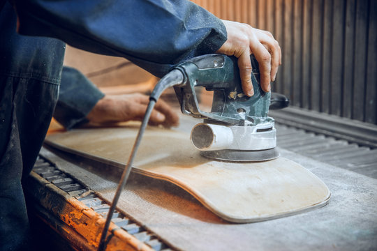 Carpenter Using Circular Saw For Cutting Wooden Boards. Construction Details Of Male Worker Or Handy Man With Power Tools