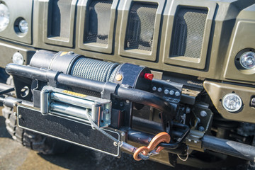 winch on an SUV close up. bad weather, 4x4, off road