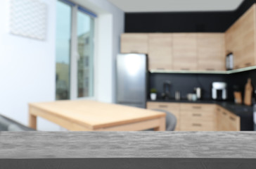 Empty table in modern kitchen. Mockup for design