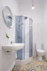Bathroom with ethnic floor tiles
