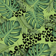 Vector seamless pattern with leopard texture and palm exotic leaves © oladolka