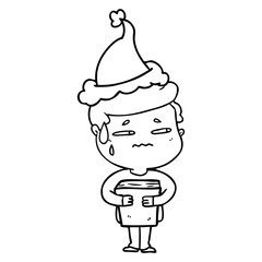 line drawing of a anxious boy carrying book wearing santa hat