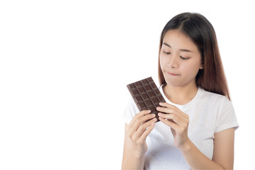 Fototapeta premium Beautiful woman with a happy smile holding a hand chocolate isolated on a white background.