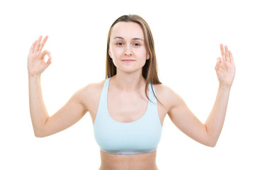 Pretty sporty blonde in doing yoga stretching exercise on white background