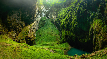 Macocha Abyss, Moravian Karst microclimate with juicy greenery and a small lake.