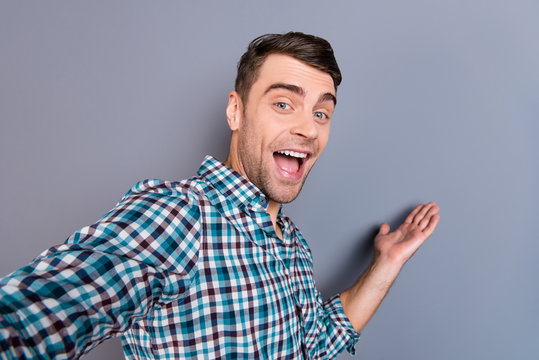 Close up photo attractive amazing macho he him his man smart phone make take selfies show way foreigners youtube blog wearing casual plaid checkered shirt outfit isolated grey background