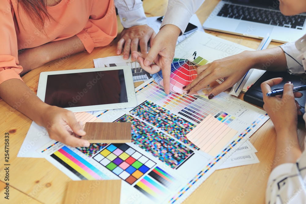 Wall mural The designer team is meeting to select various colors and raw materials in product design.