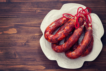 typical portuguese smoked sausages on beautiful white dish