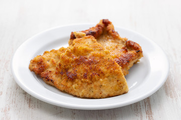 fried chicken breast on white plate