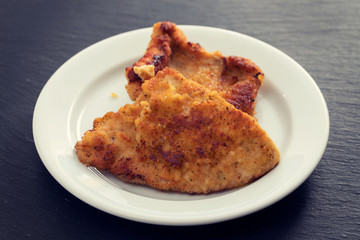 fried chicken breast on white plate