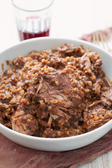 rice with rabbit and sauce in dish
