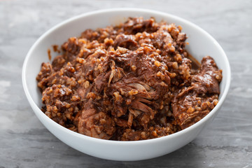 rice with rabbit and sauce in dish